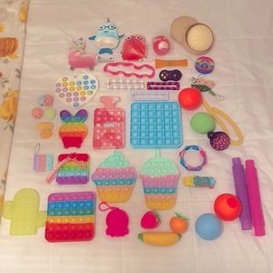 Lot of fidgets. | Pop it’s, Dimples, Stress balls, etc